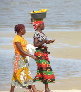 Ladies walking on beach in Mozambique