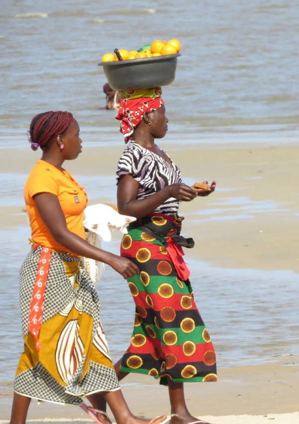 Ladies walking on beach in Mozambique