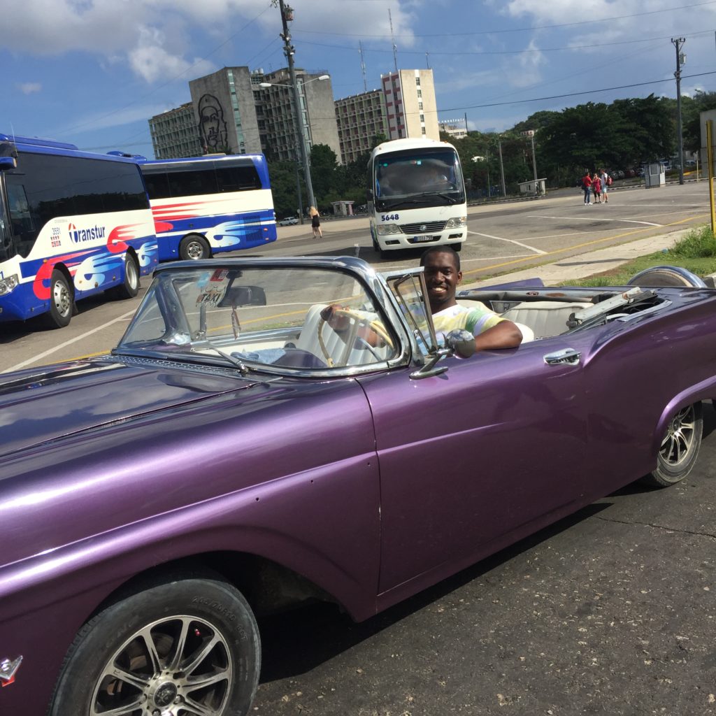 my son in car in cuba