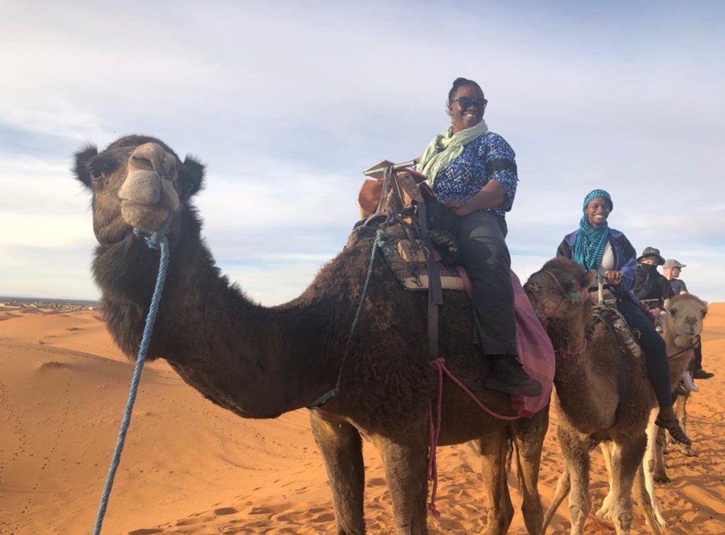 Riding camel in Sahara desert Morocco